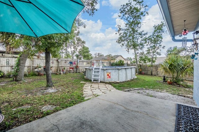 2308 Rio Cir, Spring Hill, FL 34608 - view of yard featuring a patio area