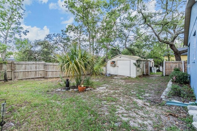 2308 Rio Cir, Spring Hill, FL 34608 - fenced backyard with a storage unit and an outbuilding
