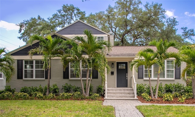 view of front of home with a front lawn