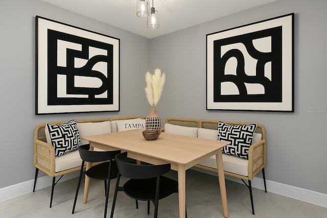 dining space with baseboards