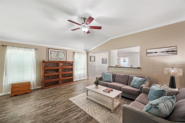 7103 Bridgeview Dr, Wesley Chapel, FL 33545 - living area featuring healthy amount of natural light, a ceiling fan, crown molding, baseboards, and lofted ceiling