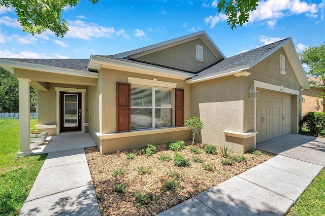 7103 Bridgeview Dr, Wesley Chapel, FL 33545 - view of front of house featuring stucco siding, a garage, concrete driveway, and roof with shingles
