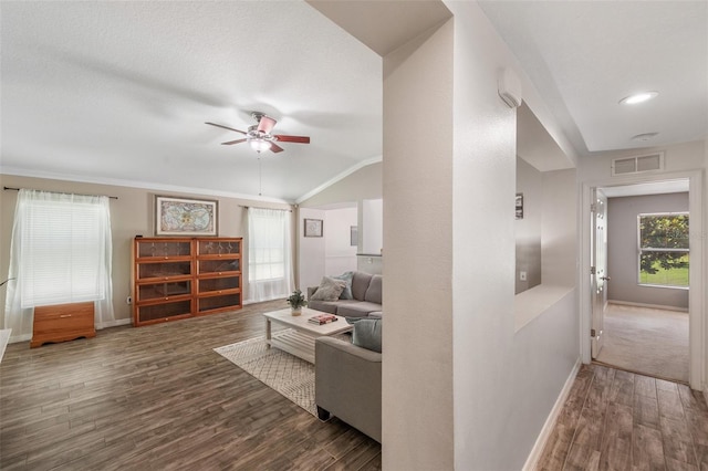 7103 Bridgeview Dr, Wesley Chapel, FL 33545 - living room with baseboards, wood finished floors, a ceiling fan, and vaulted ceiling