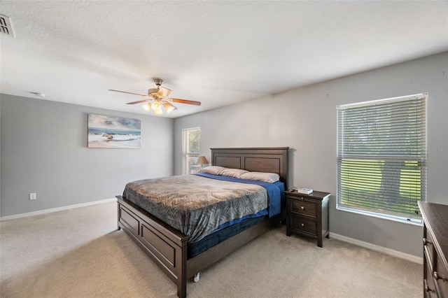 7103 Bridgeview Dr, Wesley Chapel, FL 33545 - bedroom with light carpet, baseboards, and ceiling fan