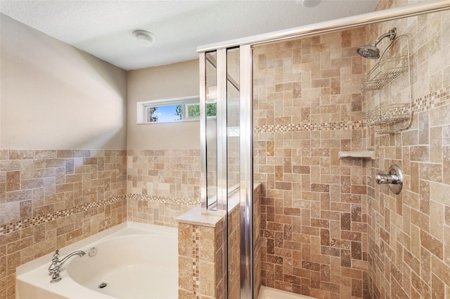 7103 Bridgeview Dr, Wesley Chapel, FL 33545 - bathroom featuring a shower stall and a garden tub