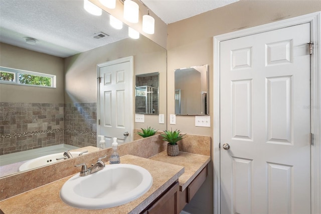 7103 Bridgeview Dr, Wesley Chapel, FL 33545 - bathroom with vanity and a textured ceiling