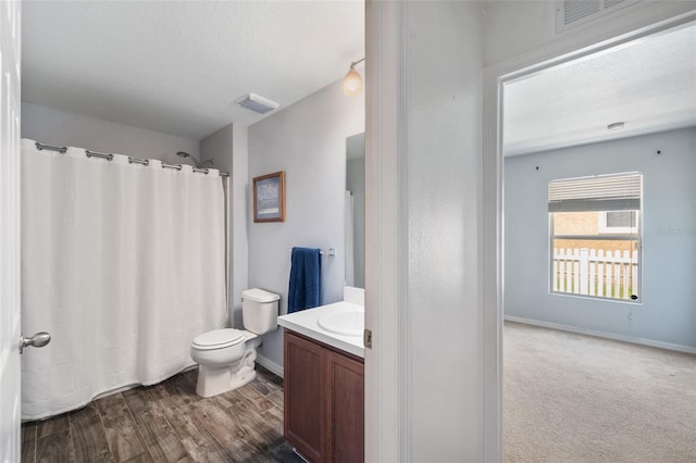 7103 Bridgeview Dr, Wesley Chapel, FL 33545 - bathroom with vanity, toilet, baseboards, and curtained shower