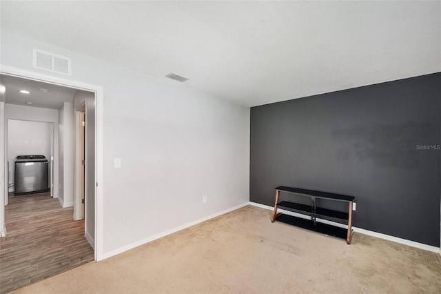 7103 Bridgeview Dr, Wesley Chapel, FL 33545 - carpeted spare room with washer / dryer and baseboards
