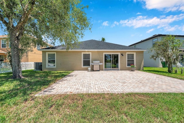 7103 Bridgeview Dr, Wesley Chapel, FL 33545 - back of property with a patio, stucco siding, and central AC unit