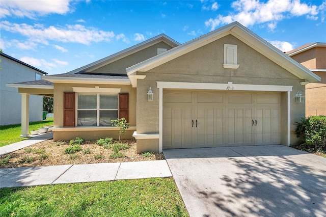 7103 Bridgeview Dr, Wesley Chapel, FL 33545 - view of front of home featuring stucco siding, a garage, and concrete driveway