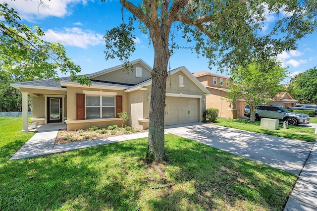7103 Bridgeview Dr, Wesley Chapel, FL 33545 - view of front of house with stucco siding, a garage, a front lawn, and driveway