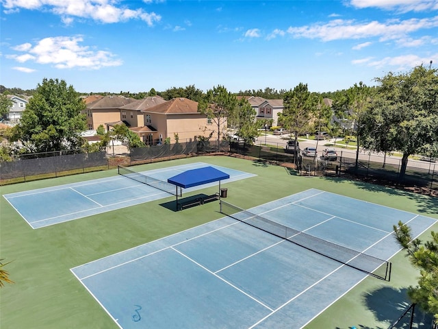7103 Bridgeview Dr, Wesley Chapel, FL 33545 - view of tennis court with a residential view