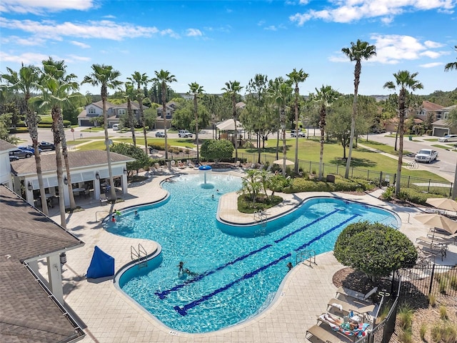7103 Bridgeview Dr, Wesley Chapel, FL 33545 - community pool with a patio area and a residential view