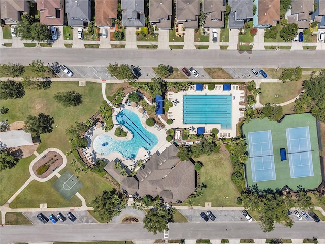 7103 Bridgeview Dr, Wesley Chapel, FL 33545 - aerial view of property's location featuring a pool area and nearby suburban area