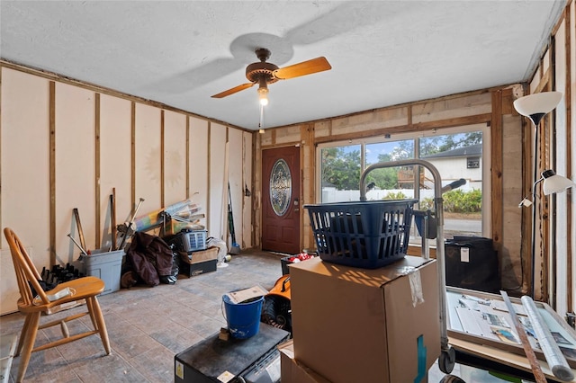 701 59th Ave NE, Saint Petersburg, FL 33703 - living area featuring ceiling fan and a textured ceiling