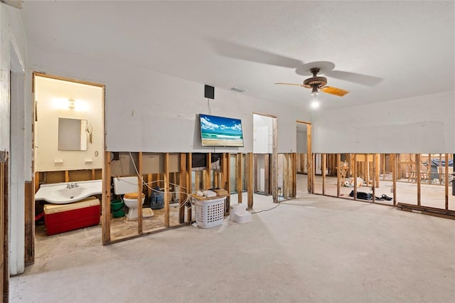 701 59th Ave NE, Saint Petersburg, FL 33703 - living room with concrete flooring and a ceiling fan