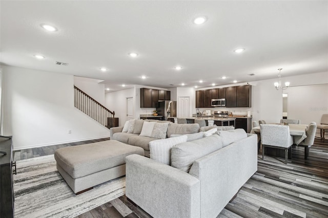 14282 Coronado Dr, Spring Hill, FL 34609 - living area featuring stairs, wood finished floors, recessed lighting, and a chandelier