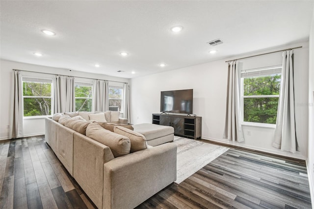 14282 Coronado Dr, Spring Hill, FL 34609 - living room featuring recessed lighting, dark wood-style flooring, and baseboards