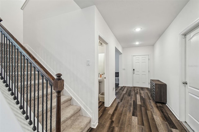 14282 Coronado Dr, Spring Hill, FL 34609 - hall featuring dark wood-style floors, stairway, recessed lighting, and baseboards
