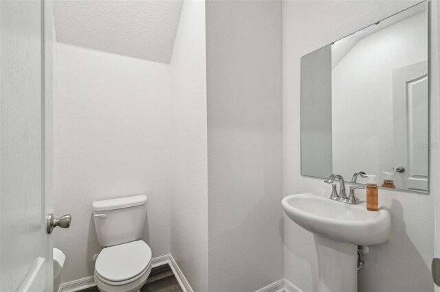 14282 Coronado Dr, Spring Hill, FL 34609 - half bath featuring toilet and baseboards