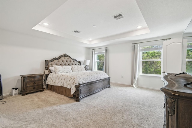 14282 Coronado Dr, Spring Hill, FL 34609 - bedroom with a tray ceiling, light colored carpet, baseboards, and recessed lighting