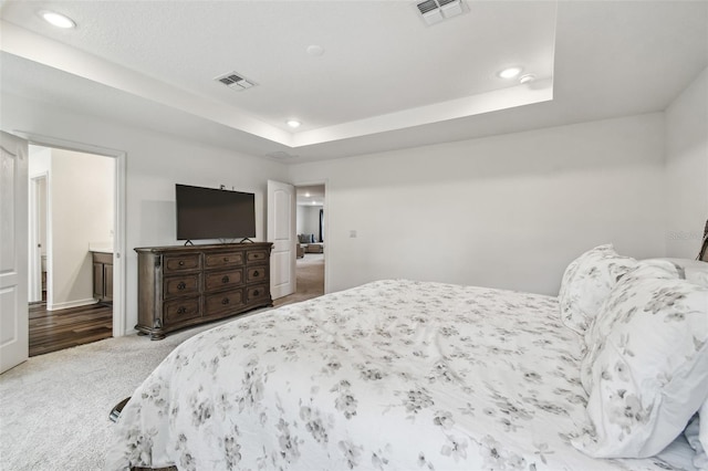 14282 Coronado Dr, Spring Hill, FL 34609 - bedroom featuring carpet floors, recessed lighting, a tray ceiling, and baseboards