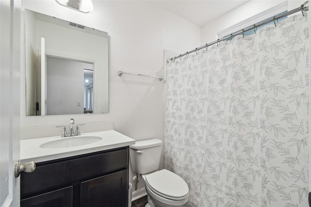 14282 Coronado Dr, Spring Hill, FL 34609 - bathroom with toilet, vanity, and curtained shower