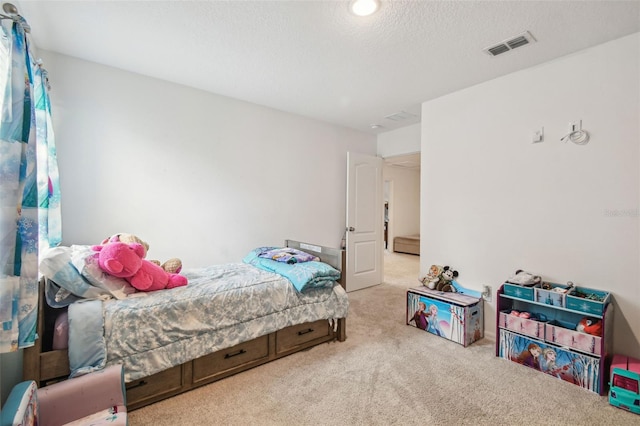 14282 Coronado Dr, Spring Hill, FL 34609 - carpeted bedroom featuring a textured ceiling