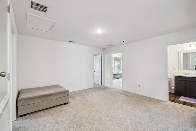 14282 Coronado Dr, Spring Hill, FL 34609 - unfurnished room featuring light colored carpet, a sink, baseboards, and attic access