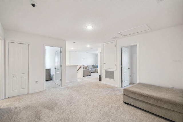 14282 Coronado Dr, Spring Hill, FL 34609 - unfurnished living room with light colored carpet, recessed lighting, and baseboards