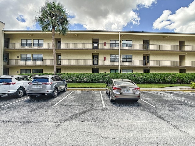14130 Rosemary Ln Unit 3215, Largo, FL 33774 - view of apartment building / complex featuring uncovered parking