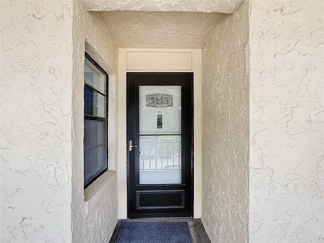 14130 Rosemary Ln Unit 3215, Largo, FL 33774 - view of exterior entry featuring stucco siding