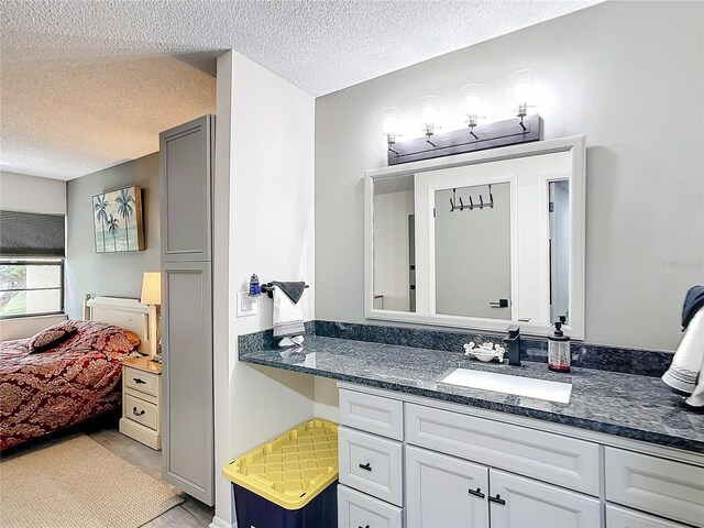 14130 Rosemary Ln Unit 3215, Largo, FL 33774 - ensuite bathroom with a textured ceiling and vanity