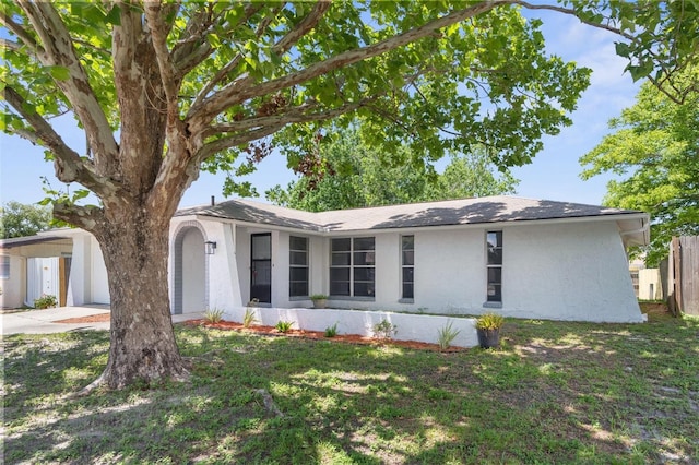 7215 San Moritz Dr, Port Richey, FL 34668 - ranch-style home with stucco siding and driveway