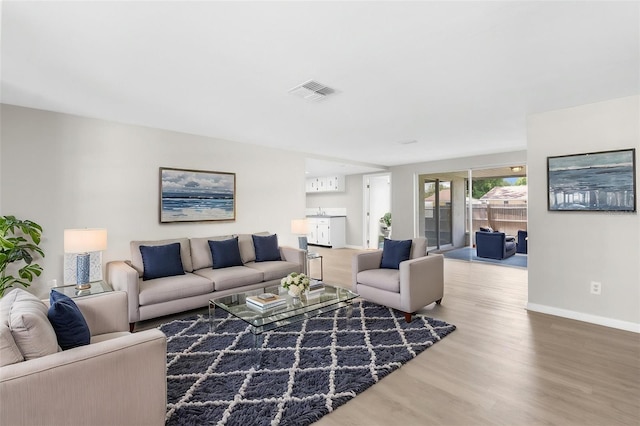 7215 San Moritz Dr, Port Richey, FL 34668 - living area with wood finished floors and baseboards