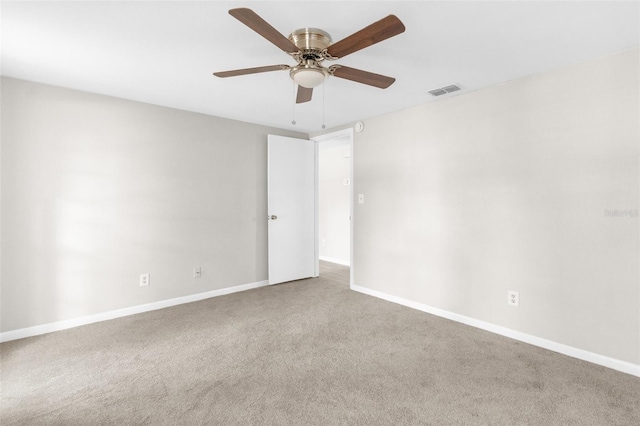 7215 San Moritz Dr, Port Richey, FL 34668 - unfurnished room with carpet flooring, ceiling fan, and baseboards