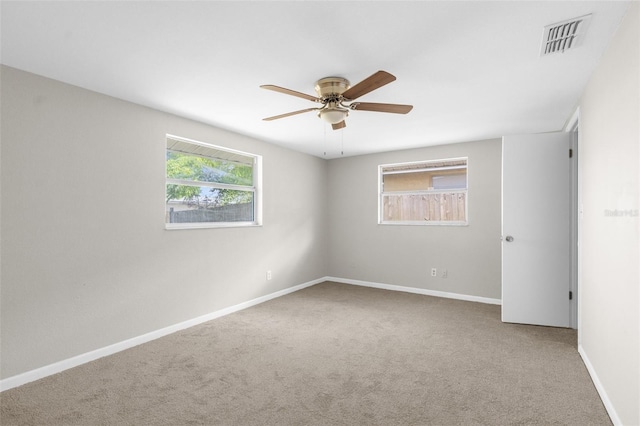 7215 San Moritz Dr, Port Richey, FL 34668 - carpeted empty room with a ceiling fan and baseboards