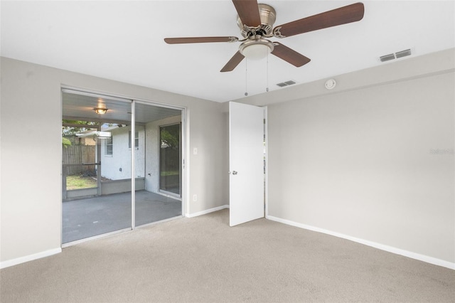 7215 San Moritz Dr, Port Richey, FL 34668 - unfurnished bedroom with carpet, baseboards, and a ceiling fan