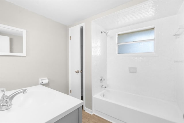 7215 San Moritz Dr, Port Richey, FL 34668 - full bath featuring shower / bathtub combination, vanity, and wood finished floors