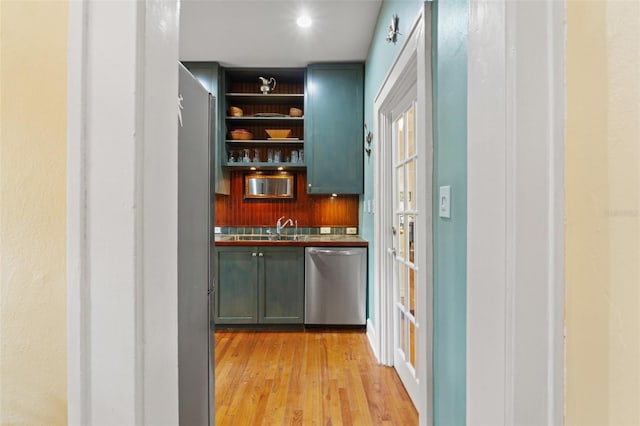 1001 E Crawford St, Tampa, FL 33604 - bar featuring dishwasher, light wood-style flooring, and a sink