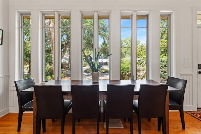 1001 E Crawford St, Tampa, FL 33604 - dining space featuring a decorative wall, wood finished floors, and wainscoting