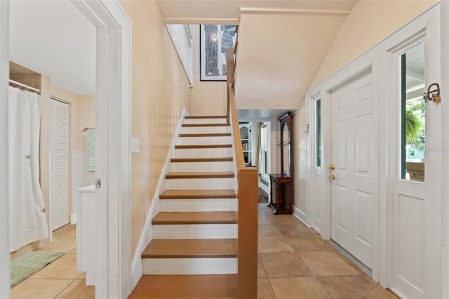 1001 E Crawford St, Tampa, FL 33604 - foyer featuring light tile patterned floors, stairway, and baseboards