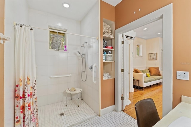1001 E Crawford St, Tampa, FL 33604 - bathroom with tiled shower, plenty of natural light, a wall unit AC, and recessed lighting