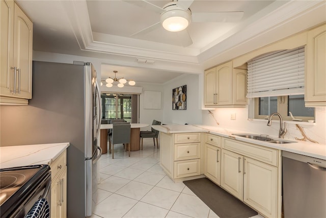 3071 Bolt Dr, Palm Harbor, FL 34685 - kitchen featuring cream cabinetry, stainless steel dishwasher, and a sink