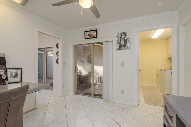 3071 Bolt Dr, Palm Harbor, FL 34685 - bedroom with separate washer and dryer, crown molding, light tile patterned flooring, a ceiling fan, and a closet