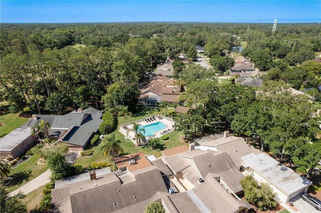 3071 Bolt Dr, Palm Harbor, FL 34685 - aerial perspective of suburban area with a forest and a pool area