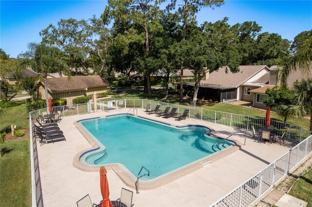 3071 Bolt Dr, Palm Harbor, FL 34685 - community pool with fence and a patio area