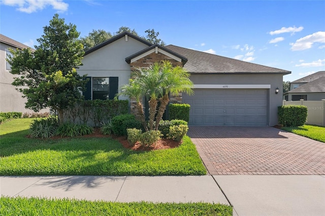 4690 Coachford Dr, Wesley Chapel, FL 33543 - ranch-style house featuring decorative driveway, stucco siding, and a garage