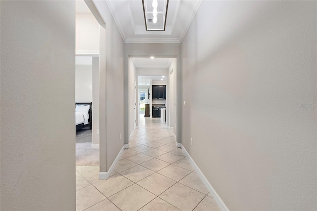 4690 Coachford Dr, Wesley Chapel, FL 33543 - hall with ornamental molding, light tile patterned flooring, baseboards, and a textured wall