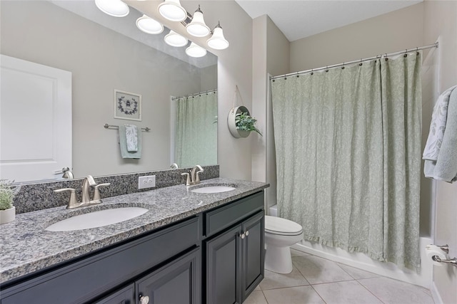 4690 Coachford Dr, Wesley Chapel, FL 33543 - full bathroom featuring tile patterned floors, toilet, double vanity, and shower / bath combination with curtain